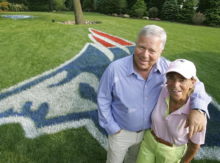 Myra and Robert Kraft stand next to a Patriots logo outside their house in Brookline in June 2005. (AP)