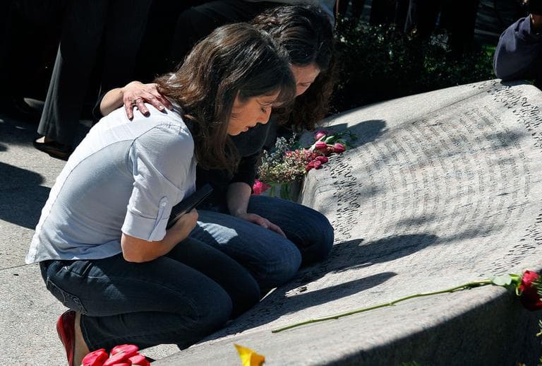Sisters Carie, left, and Danielle Lemack, whose mother, Judy Larocque, died on the ill-fated Flight 11 from Logan Airport on 9/11, grieve in Boston this year at the Garden of Remembrance. (AP)