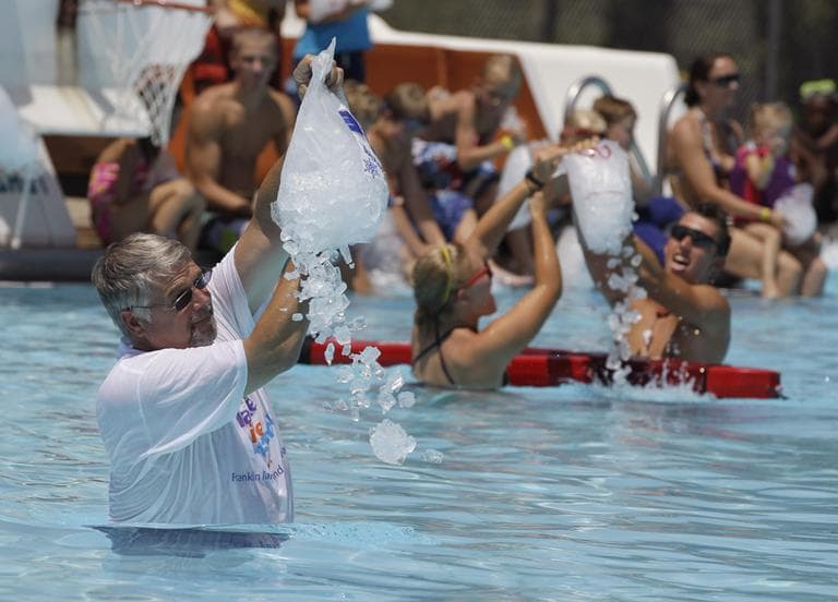 Mayor Fred Paris pours one of the 250 bags of ice into the Franklin Memorial Swimming Pool in Franklin, Ind., Thursday, July 21, 2011. Temperatures are expected to climb into the high 90's with heat index well over 100. (AP)