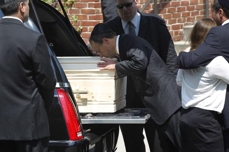Jonathan Kraft kisses the casket of his mother Myra Kraft, the wife of New England Patriots owner Robert Kraft, at Temple Emmanuel in Newton, Friday. (AP)