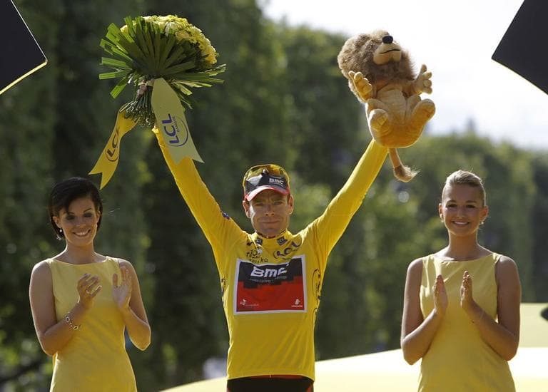 Tour de France winner Cadel Evans of Australia, wearing the overall leader's yellow jersey, stands on the podium after winning the Tour de France in Paris on Sunday. (AP)