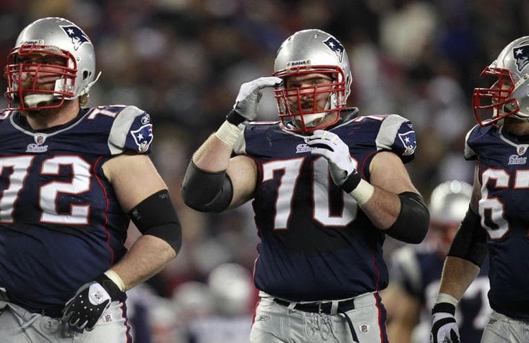 After the NFL and the players union came to an agreement, the Patriots can start to resolve guard Logan Mankins' (center) contract situation. (AP)