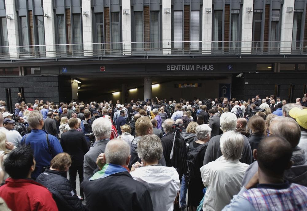 People gather outside the court in Oslo, Norway, where Anders Breivik is being arraigned. (AP)