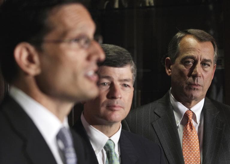 House Speaker John Boehner, right, and Republican Conference Chairman Rep. Jeb Hensarling, center, listen as House Majority Leader Eric Cantor gives a news conference in Washington, Tuesday. (AP)