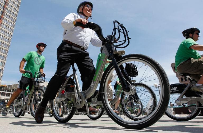 Cyclists depart Boston&#039;s City Hall Plaza in July 2011 to launch the Hubway bike system. (AP File)