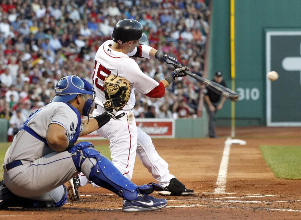 Boston Red Sox&#039;s Dustin Pedroia (15) hits a solo home run to left as Kansas City Royals catcher Brayan Pena is behind the plate during the first inning of the game in Boston on Wednesday. (AP)