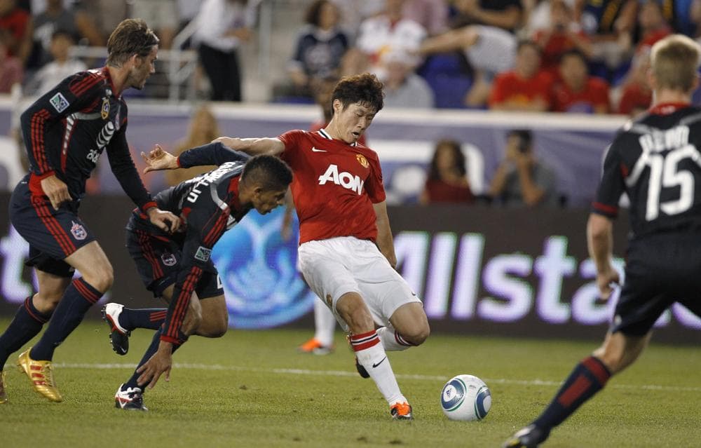 Manchester United's Ji-Sung Park scores against the MLS All-Stars during the MLS All-Star Game on Wednesday in N.Y. (AP)