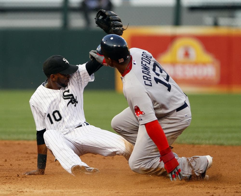 Chicago White Sox shortstop Alexei Ramirez, left, watches ball skip by as Boston Red Sox&#39;s Carl Crawford steals second base in the fifth inning. (AP)