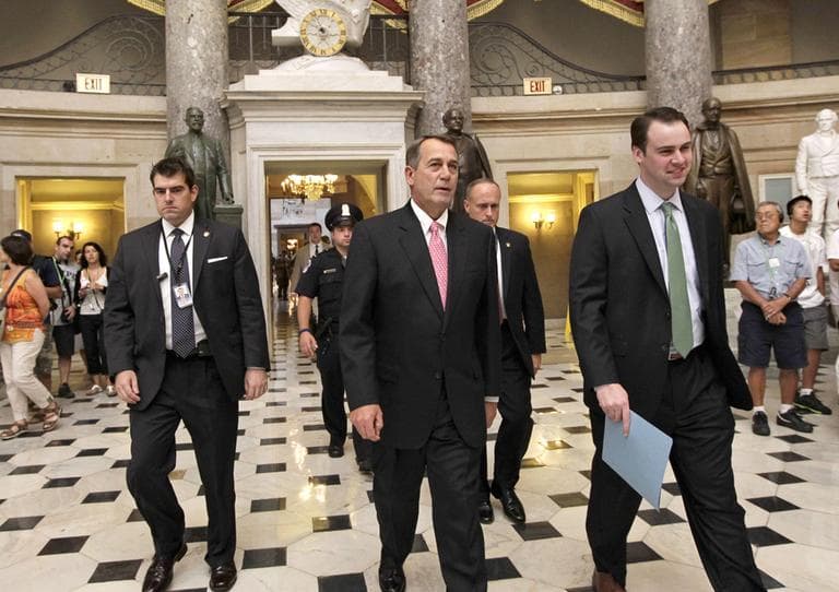 Rep. John Boehner, center, walked through Capitol Hill Monday. (AP)