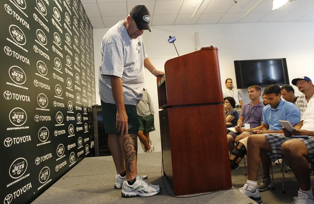 New York Jets head coach Rex Ryan points at his new tattoo during a press conference at Atlantic Health Training Center in Florham Park, N.J. (AP)