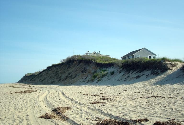 Statistically, the erosion seen here on Nauset Light Beach in Eastham will catch up to this house is about 10 years. (Adam Ragusea/WBUR)