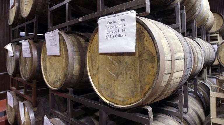 These aging hardwood barrels of the Utopias selection stacked in the barrel room of the Boston Beer Company, would not be brewed in Mass. under new rules by the state&#039;s Alcoholic Beverages Control Commission. (AP)