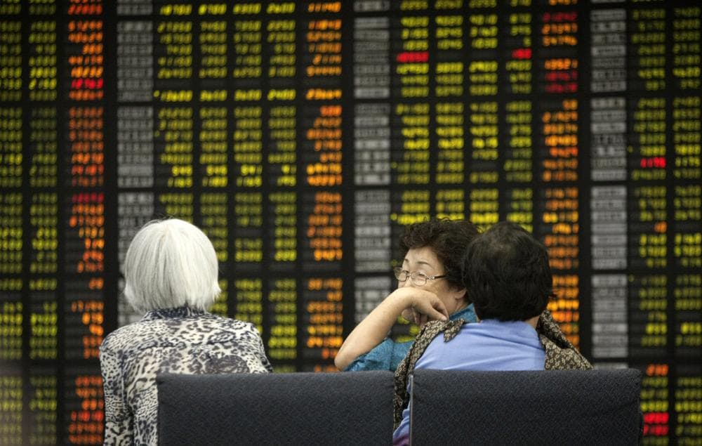 Asian stocks nose-dived Monday as the first-ever downgrade of the U.S. government's credit rating jolted the global financial system. (AP)