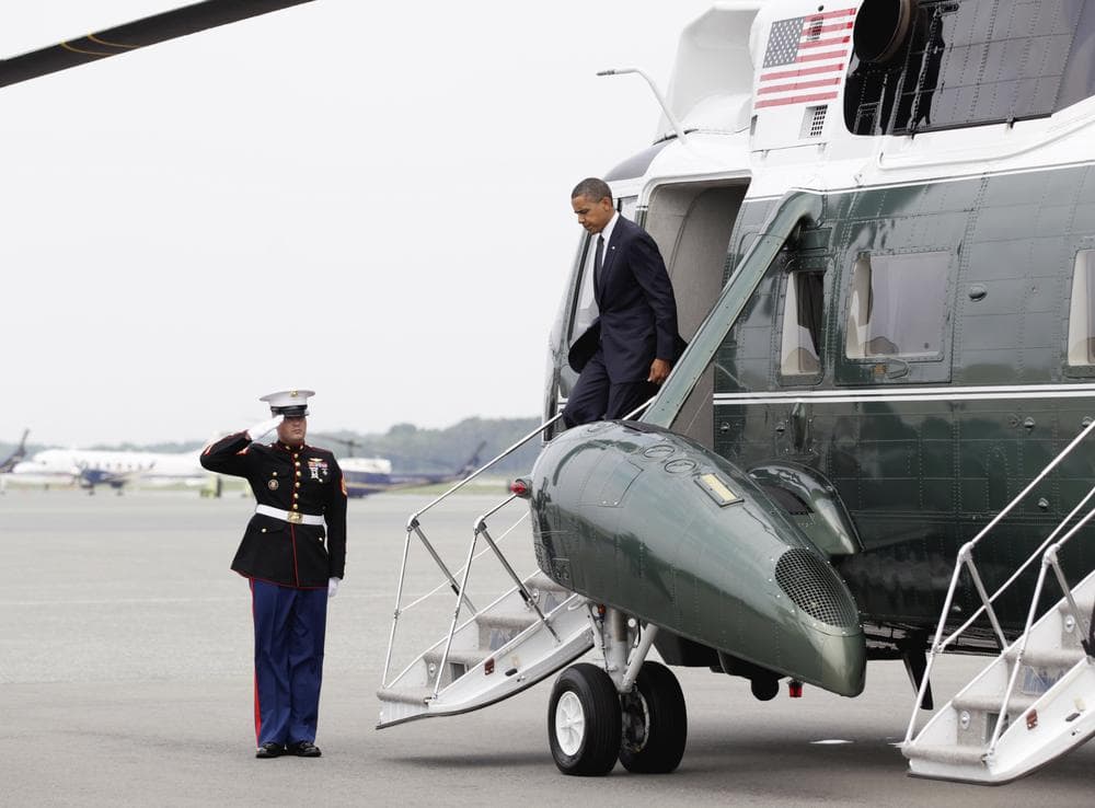 President Barack Obama steps off of Marine One at Dover Air Force Base, Delaware to pay tribute to 30 fallen soldiers. (AP) 