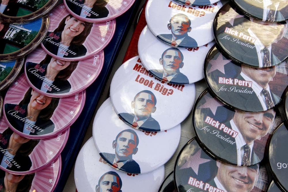 Campaign buttons for Republican presidential candidates Rep. Michele Bachmann, R-Minn. and Texas Gov. Rick Perry are seen along with ones that are anti-President Barack Obama buttons at yesterday's Black Hawk County Republican Party Lincoln Day Dinner in Waterloo, Iowa. (AP)