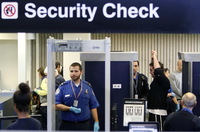 Passengers pass through a security checkpoint at Logan Airport in October 2010. (AP)