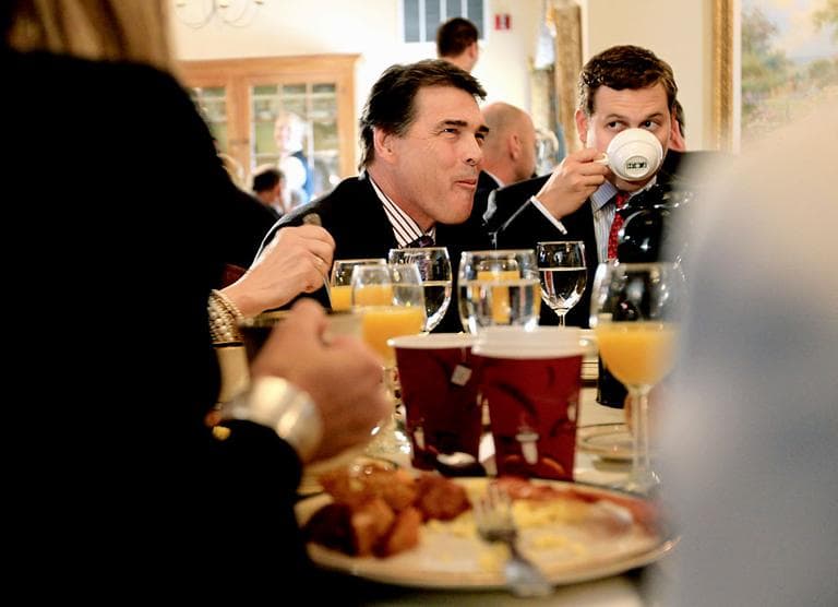 Republican presidential candidate Texas Gov. Rick Perry, with son Griffin, right, attend the Politics and Eggs Breakfast Wednesday in Bedford, N.H. (AP)