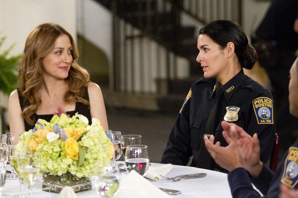 In this publicity image released by TNT, Sasha Alexander, left, and Angie Harmon are shown in a scene from the series &quot;Rizzoli &amp; Isles.&quot; (AP)