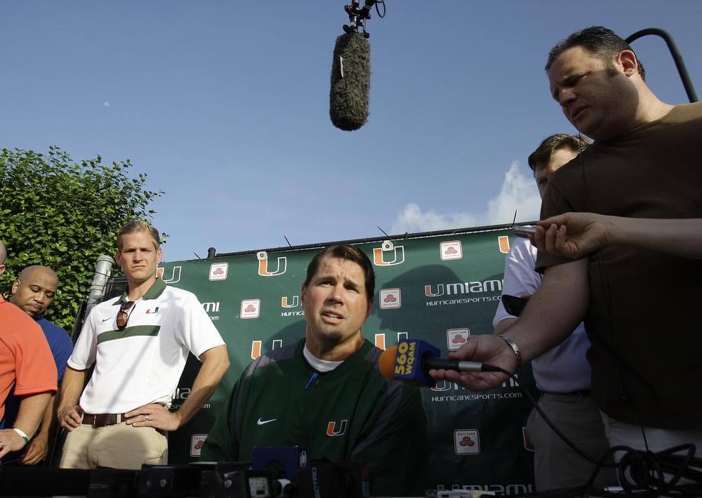 Miami's head football coach Al Golden, center, during a news conference before football practice in Coral Gables, Florida, on Thursday. (AP)