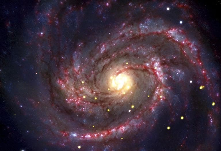 This composite image provided by NASA, shows a galaxy where a recent supernova probably resulted in a black hole in the bright white dot near the bottom middle of the picture. (AP)