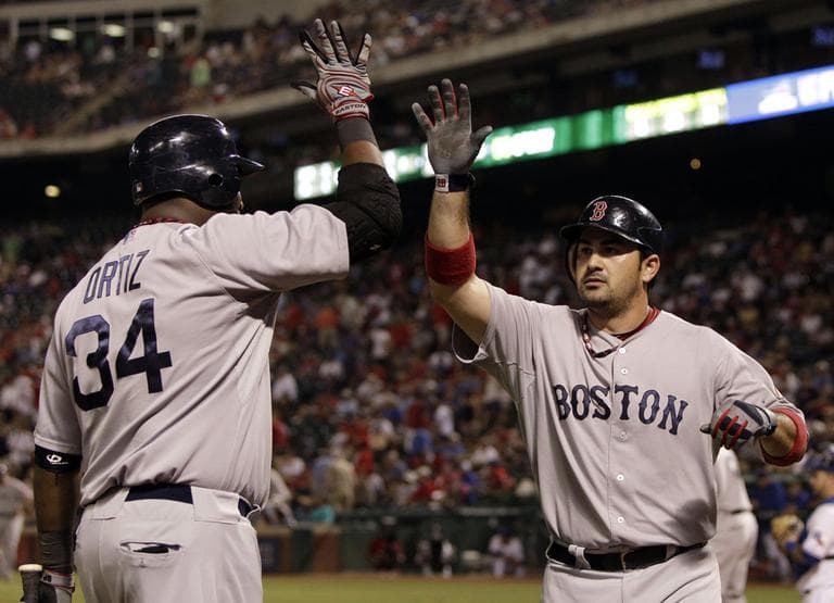 Boston Red Sox&#39;s David Ortiz congratulates Adrian Gonzalez, right, on his two run home run in the eighth inning against the Texas Rangers on Wednesday. (AP)