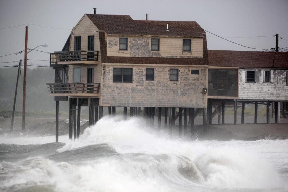 Waves roll ashore in Scituate, Mass., as Tropical Storm Irene moved through the area, Sunday. (AP)