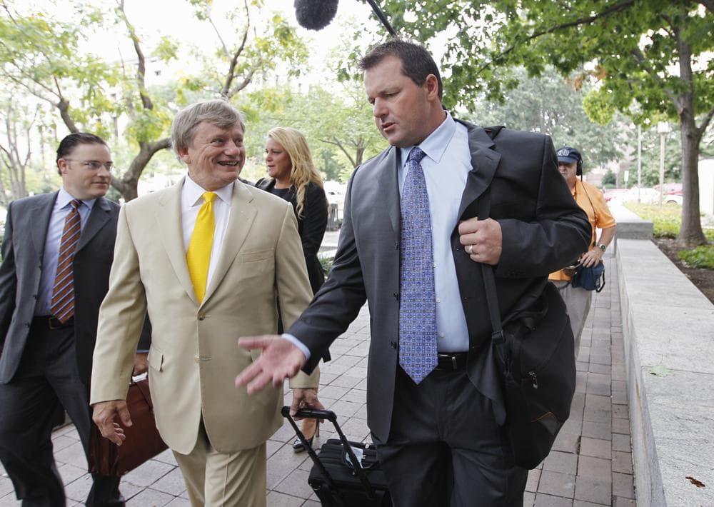 Former Major League Baseball pitcher Roger Clemens, right, and his attorney Rusty Hardin, arrive at federal court in Washington. Clemens was due in court to find out whether he'll face a second trial on charges that he lied about using performance-enhancing drugs.