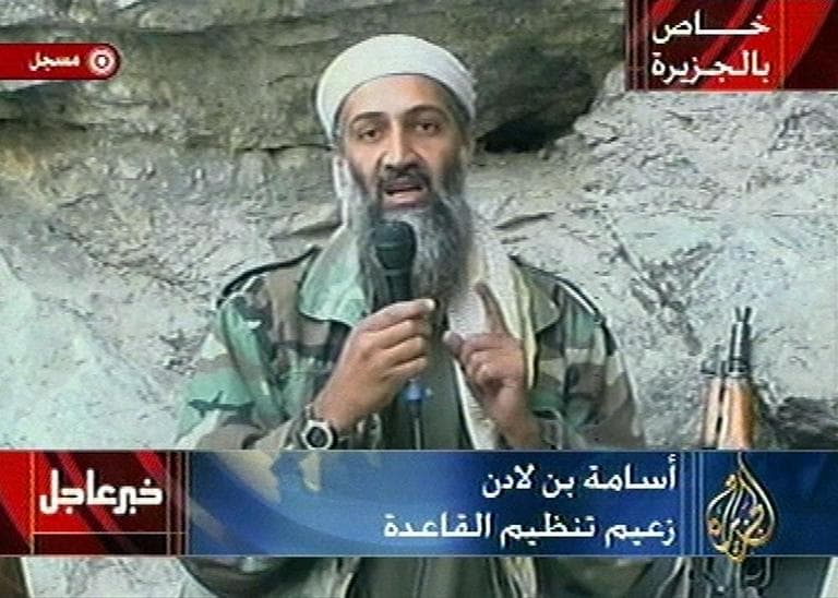 Osama bin Laden is seen at an undisclosed location in this television image broadcast Sunday Oct. 7, 2001.