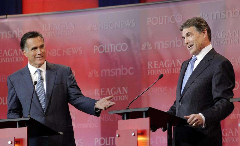 Republican presidential candidates former Massachusetts Gov. Mitt Romney, left, and Texas Gov. Rick Perry answer a question during a Republican presidential candidate debate in Simi Valley, Calif. (AP)