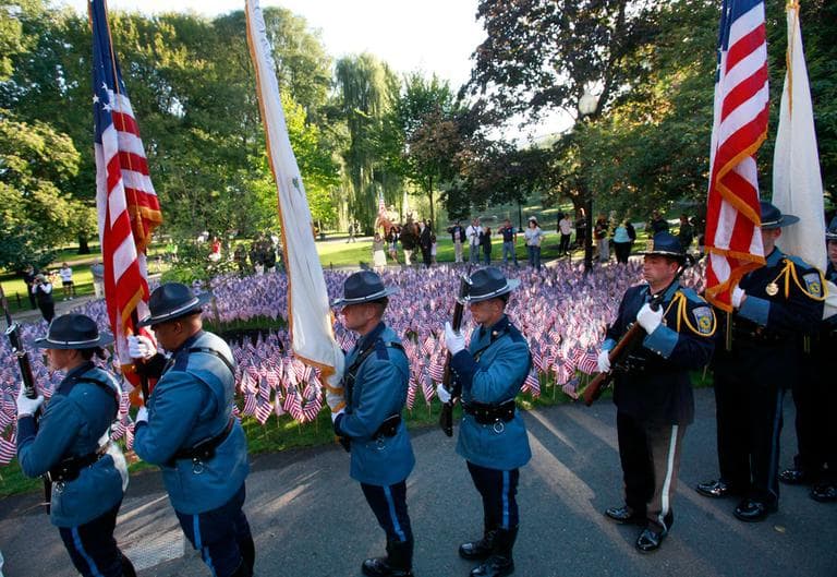 A police color guard stands in front of 3,000 American flags, symbolizing the victims of the 9/11 terror attacks, during ceremonies in the Boston Public Garden Sunday. (AP)