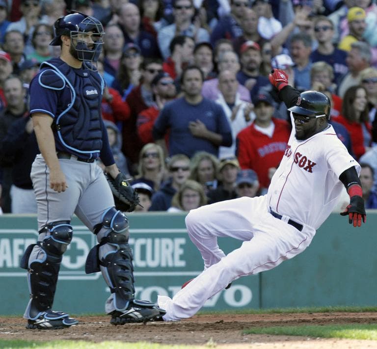 Boston Red Sox&#039;s David Ortiz, right, scores in front of Tampa Bay Rays&#039; Kelly Shoppach on an RBI-double by the Red Sox&#039;s Darnell McDonald in the fourth inning of a baseball game on Sunday. (AP)