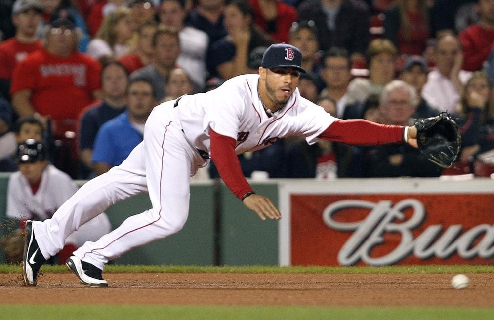 Boston&#039;s third baseman Mike Aviles dives but cannot reach a single by Baltimore&#039;s J.J. Hardy in the eighth inning of the game in Boston on Wednesday. (AP)
