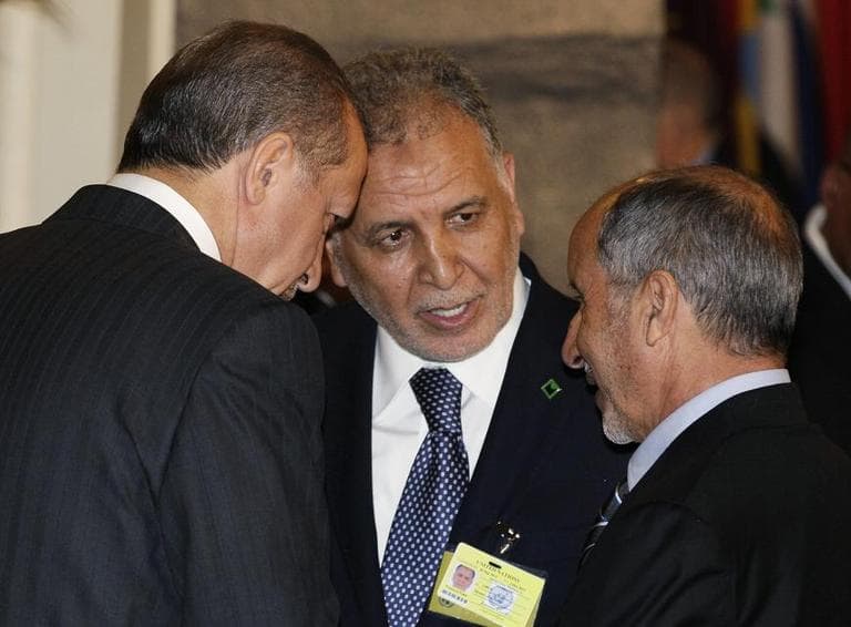Turkish Prime Minister Recep Tayyip Erdogan, left, speaks with two members of Libya's Natioal Transitional Coucil, Mukhtar Abdurrazaq, center, and Chairman Mustafa Abdel Jalil, at a UN luncheon. 