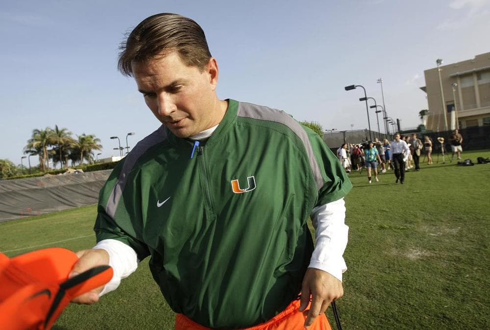 In August, Miami's head football coach, Al Golden, leaves a news conference before football practice in Coral Gables, Fla. Allegations surfaced last month of a booster give illicet benefits to players. (AP)