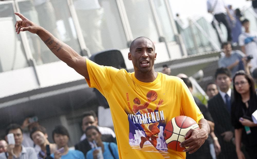 Los Angeles Lakers superstar Kobe Bryant reacts during a basketball clinic last weekend in Singapore. Bryant is considering playing overseas as the NBA lockout continues. (AP)