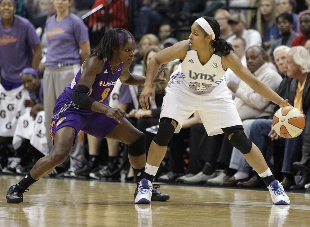 Minnesota Lynx forward Maya Moore protects the ball from Phoenix Mercury guard Marie Ferdinand-Harris during Game 1 of the Western Conference Finals on Thursday. (AP)