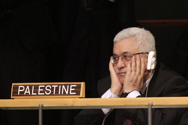 Palestinian President Mahmoud Abbas holds his hands to his face as U.S. President Barack Obama speaks during the 66th session of the General Assembly at United Nations headquarters on Wednesday. (AP)