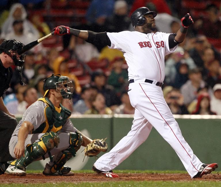 The Red Sox' David Ortiz hits a home run against the Oakland A's, Aug. 27. (AP)
