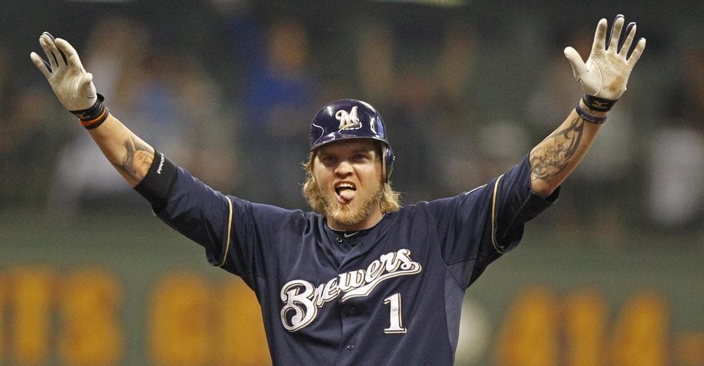 Corey Hart of the Milwaukee Brewers reacts to his two-RBI double during the seventh inning of Saturday's game against the Florida Marlins. The Brewers have secured their spot in the 2011 postseason. (AP)