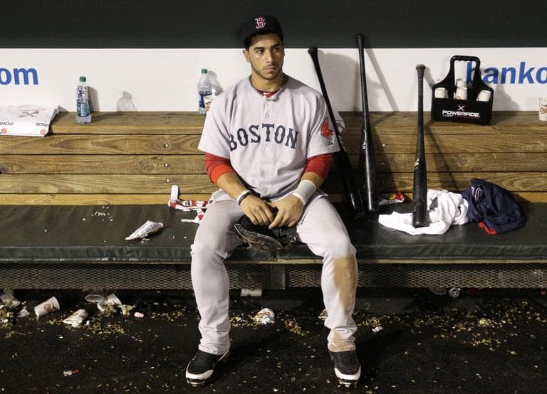 Boston&#039;s third baseman Mike Aviles sits in the dugout after Boston&#039;s loss to the Orioles, Wednesday. (AP)