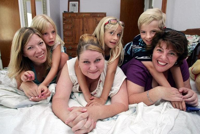 Three mothers and their kids - from left, Dawn Warthen and her daughter Allyson Cross, Michelle Jorgenson and her daughter Cheyenne, and Jenafer Elin and her son Joshua - during a reunion in 2006. The kids are half-siblings and all have the same sperm donor: number 3066. (AP)