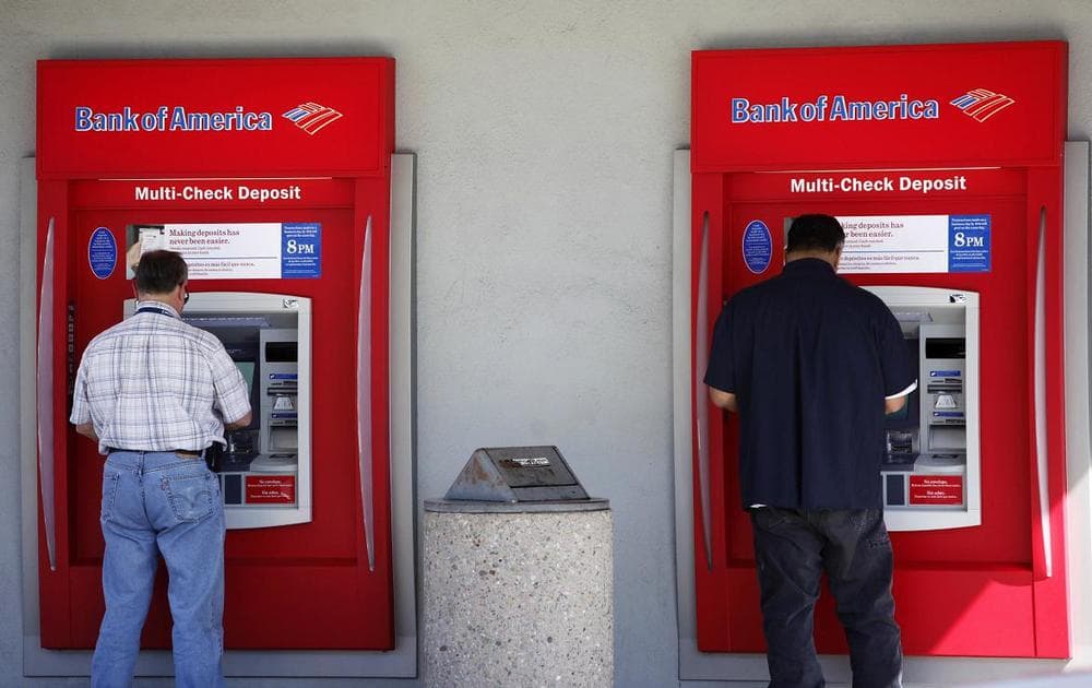 Two customers use an ATM at a Bank of America bank in California. (AP)