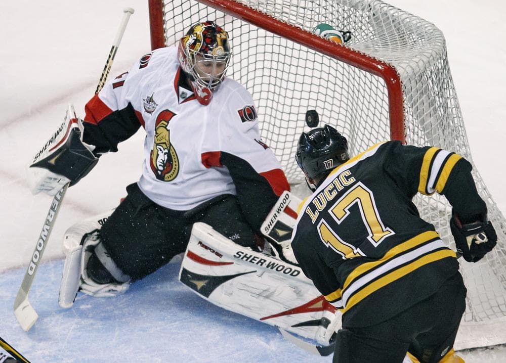 Boston&#039;s Milan Lucic,(17) beats Ottawa goalie Craig Anderson for a goal in the first period of the preseason game in Boston on Thursday. (AP)