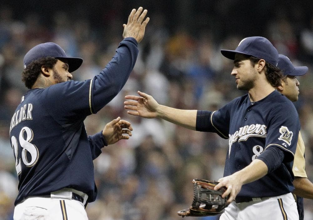 Prince Fielder and Ryan Braun of the Milwaukee Brewers celebrate securing their spot in the postseason after Wednesday night's win over the Pittsburgh Pirates. (AP)