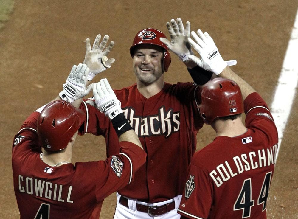 Cole Gillespie of the Diamondbacks celebrates his grand slam against the Dodgers with teammates Collin Cowgill and Paul Goldschmidt on Wednesday. (AP)