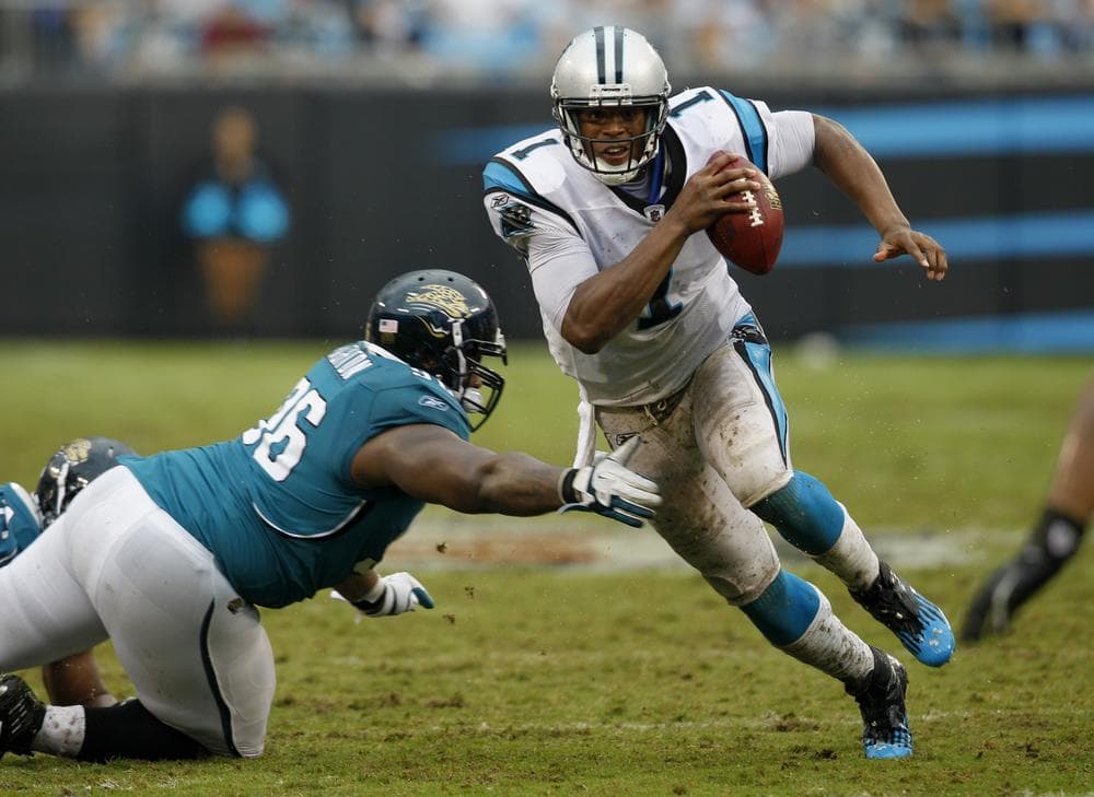 Carolina Panthers' Cam Newton scrambles away from Jacksonville Jaguars' Terrance Knighton during the fourth quarter of the Panthers' 16-10 win on Sunday. Newton threw for 168 yards. (AP)