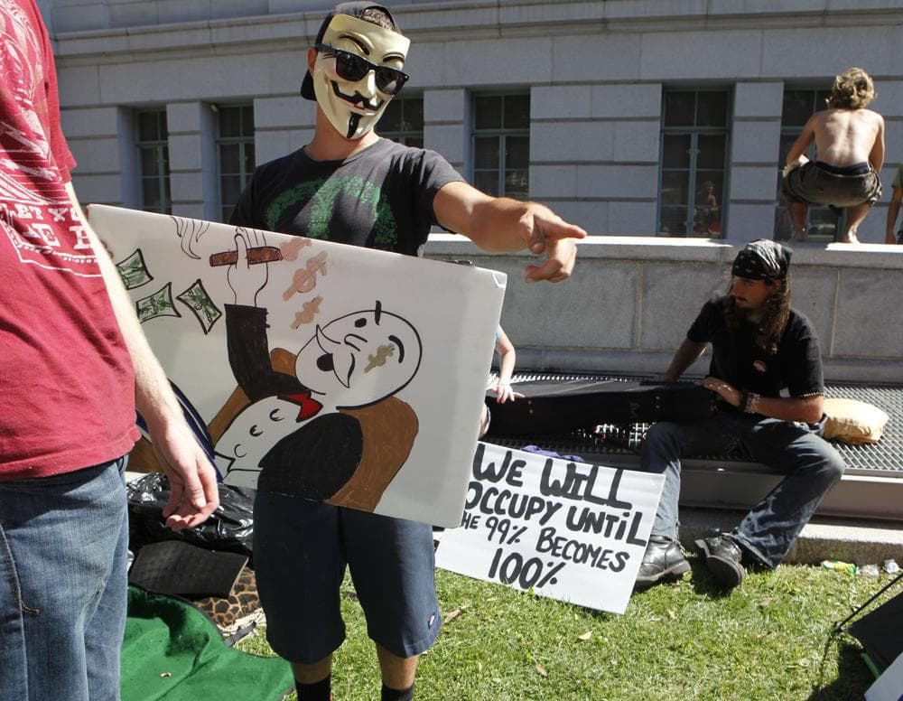 Anti-Wall Street protestors yesterday camped on the lawn of Los Angeles City Hall, in concert with demonstrations in other cities including New York and Boston. (AP)