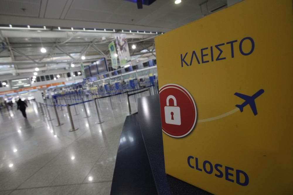 A sign inform passengers that the check in counters are closed at Eleftherios Venizelos airport during a  24-hour general strike in Athens on Wednesday. Greek civil servants walked off the job on a 24-hour strike, paralyzing the public sector in a protest over ever-deeper austerity measures applied as the government struggles to avoid a catastrophic default. Air traffic controllers joined the strike, grounding all flights to and from Greek airports.  (AP)