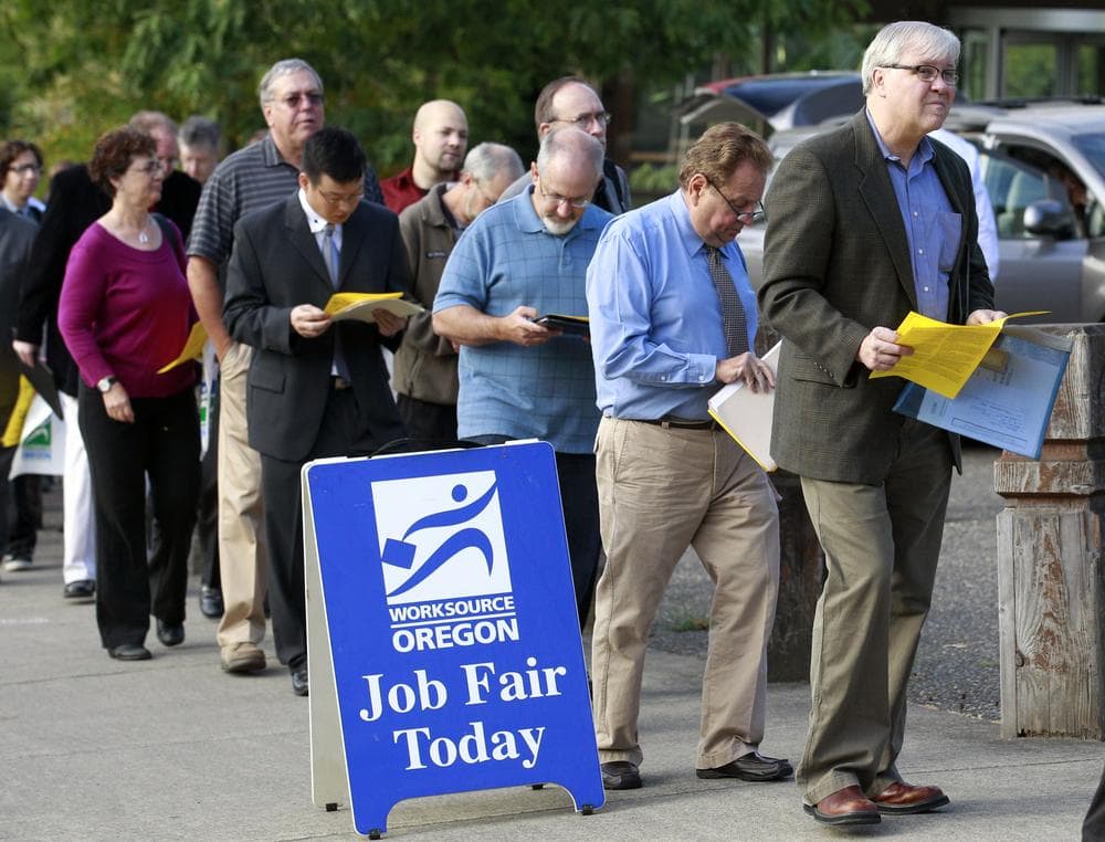 People wait in line at the 2011 Maximum Connections Job and Career Fair in Portland, Ore. (AP)