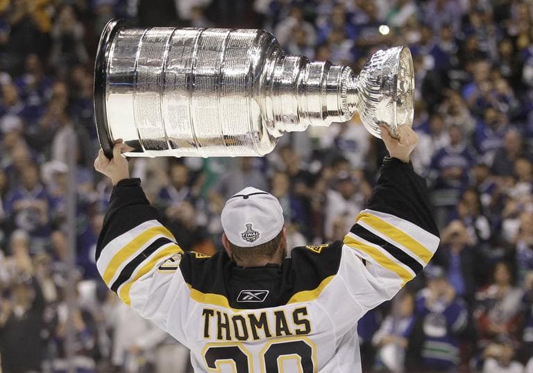 Boston Bruins goalie Tim Thomas hoists the Stanley Cup after the Boston Bruins beat the Vancouver Canucks 4-0 during Game 7 of the NHL hockey Stanley Cup Finals in June. (AP)